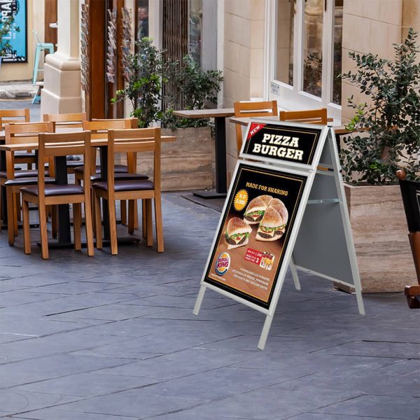 A Frame Board with Pizza Burger poster outside of a restaurant