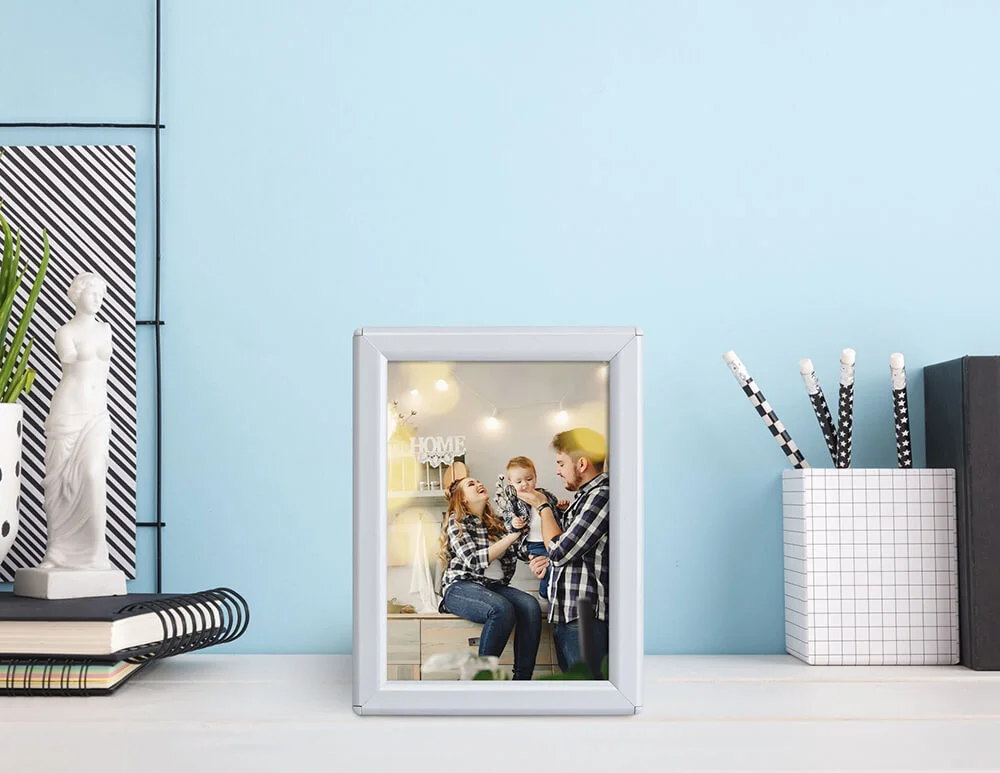 opti-frame-5-x-7-055-white White Opti Frame with a picture of a family in it