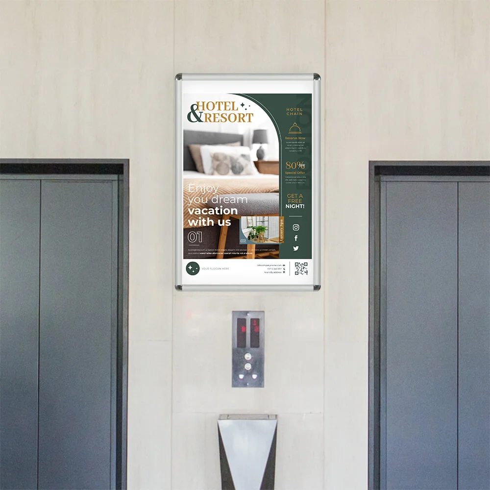 snap-poster-frame-1-inch A snap poster frame hanging in between two elevators