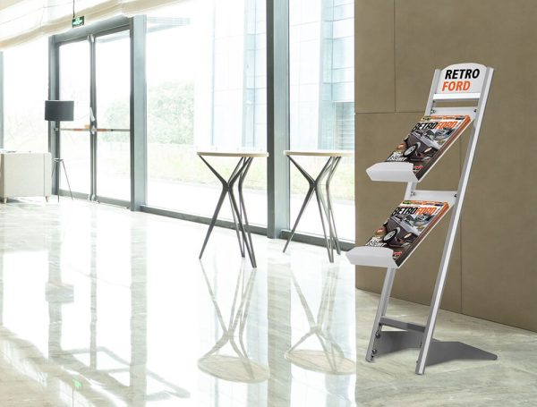 A two tiered brochure stand in the lobby of a hotel