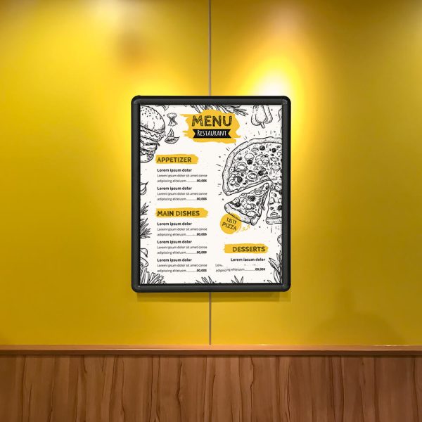 Menu in a snap poster frame hanging on a yellow wall