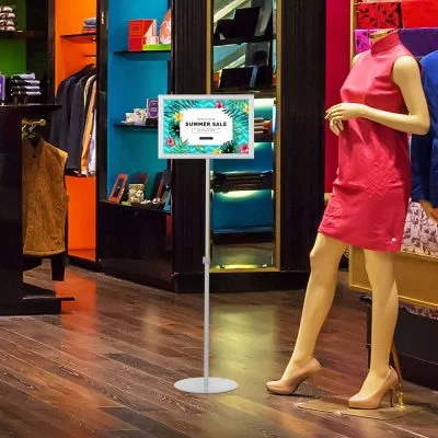 Landscape Adjustable Floor sign stand holder in a clothing store advertising a sale that is taking place