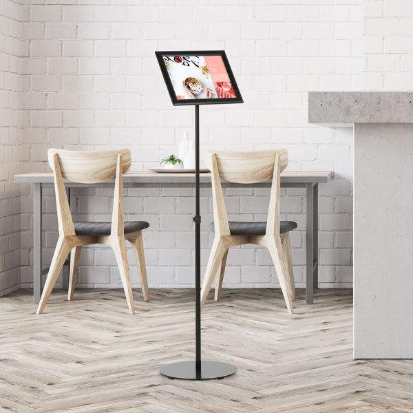 Landscape Adjustable Floor sign stand holder in a minimalist cafe