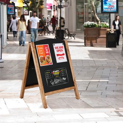 Timber Chalk Board advertising an open restaurant in the middle of the shopping center