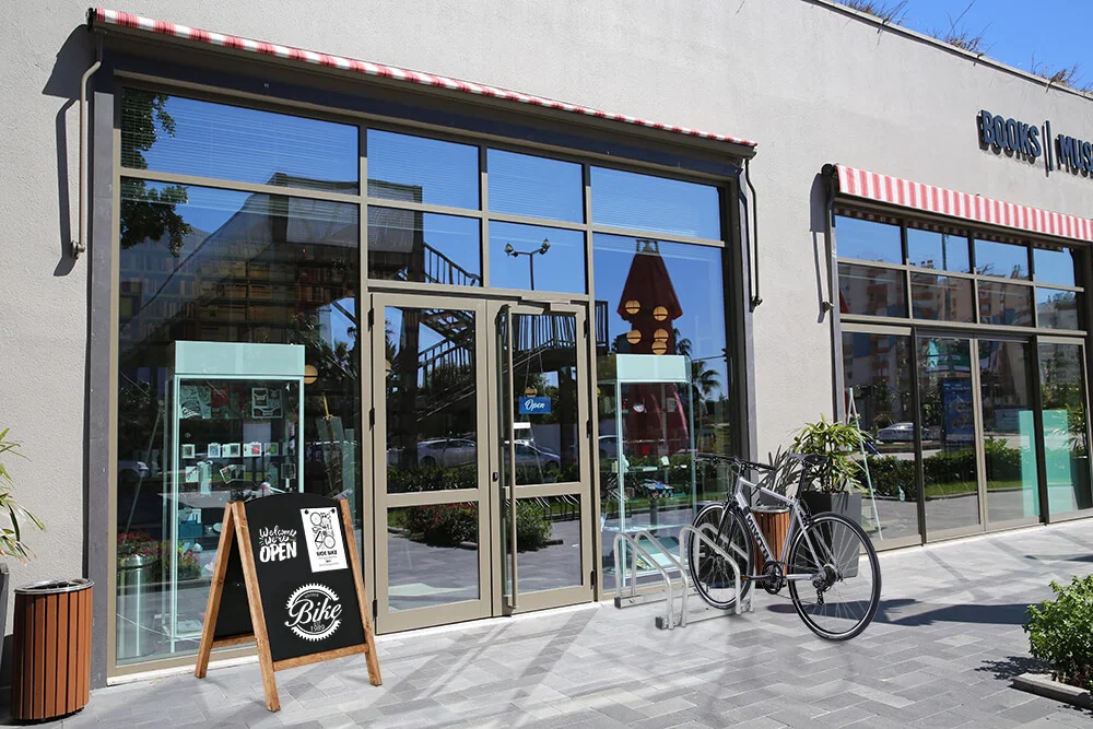 23-6-x-30-70-timber-chalk-board Timber Chalk Board outside of a bike shop that has the hours of the shop on it