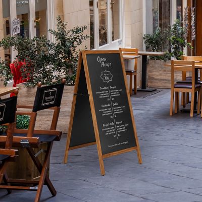 Wooden A-Board Chalkboard outside of a restaurant highlighting the menu