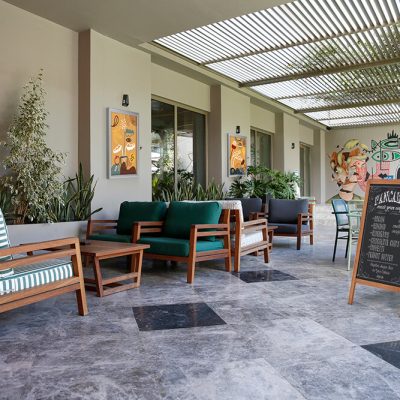 Wooden A Frame Chalk board in an outdoor seating space