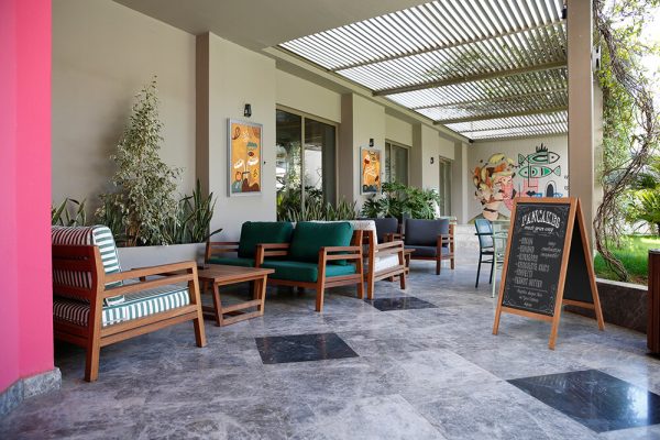 Wooden A Frame Chalk board in an outdoor seating space