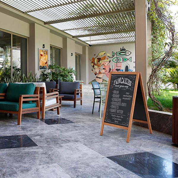 Wooden A Frame Chalk board in an outdoor seating space