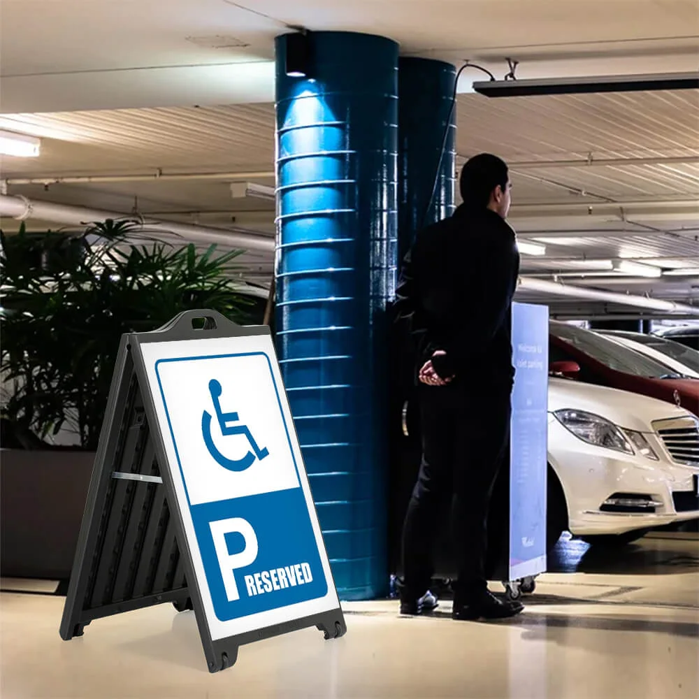 UPSP320024X9121 Handicap Parking Reserved sign on a SignPro Sidewalk Sign in a parking garage next to the valet