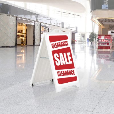 Clearance/Sale Sign on a white SignPro Sidewalk Sign in a shopping mall