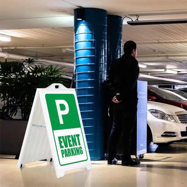 Event parking sign on a white SignPro Sidewalk sign in a parking garage next to a valet