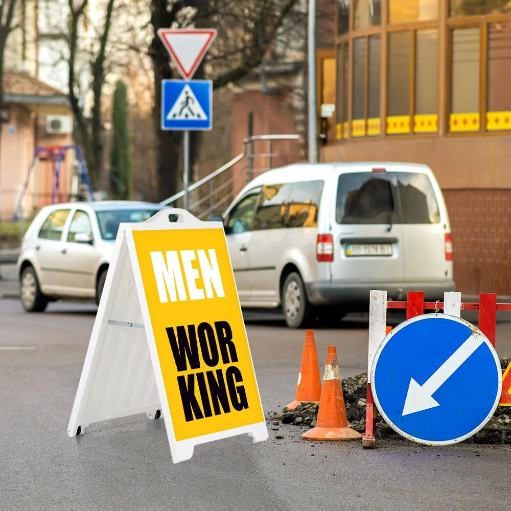 signpro-sidewalk-sign Men working sign on a white SignPro sandwich A Board