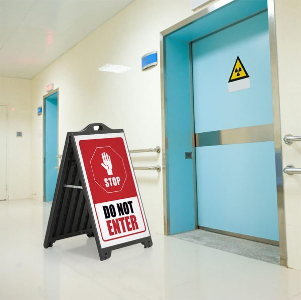 Stop, Do not enter sign on a SignPro Sidewalk Sign outside the door of a hazardous room in a hospital