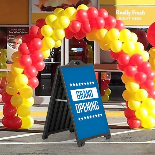 Grand Opening Sign on a SignPro Black A-Board Sidewalk Sign underneath a balloon arch outside of a brand new restaurant