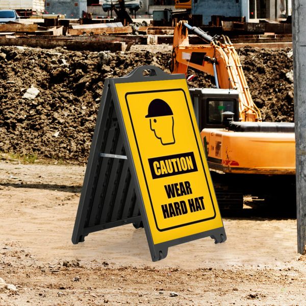 Caution wear hard hat sign on a Black A-Board Frame SignPro Sidewalk Sign out in a construction zone