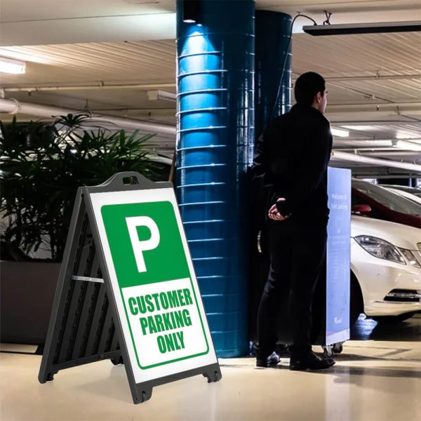 Customer parking only sign on a Black A-Frame SignPro Sidewalk sign in a parking garage next to the valet