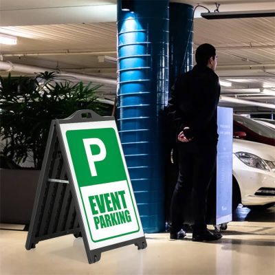 Even t Parking only sign on a black A-Board SignPro Sidewalk Sign next to a valet