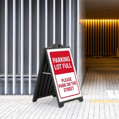 Parking Lot full poster on a Black A-Board SignPro Sidewalk Sign outside of a parking garage enterance