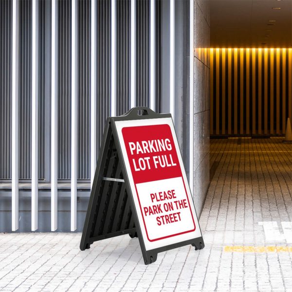 Parking Lot full poster on a Black A-Board SignPro Sidewalk Sign outside of a parking garage enterance