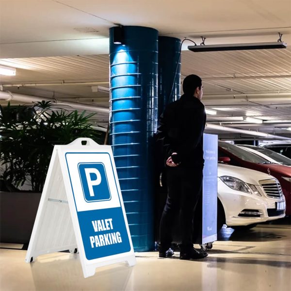 Valet Parking sign on a white SignPro sidewalk sign in a parking garage next to the valet