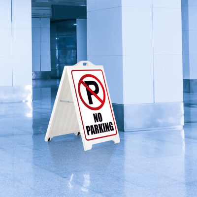 No parking Sign on a White SignPro Sidewalk Sign outside of a parking garage