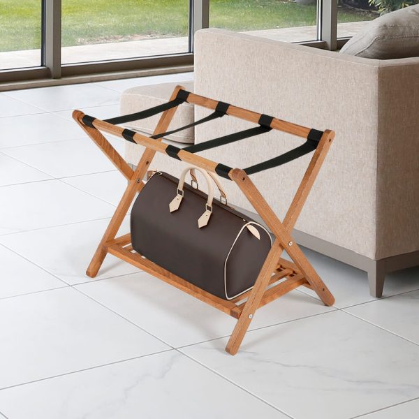 Dark Wood Beech Wood Folding Luggage Rack Next to a Couch with a Duffel bag on it