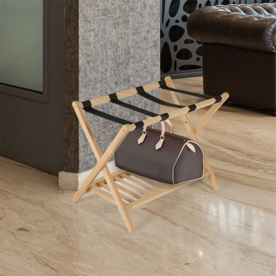 Natural Wood Beech Wood Folding Luggage Rack Next to a Couch with a Duffel bag on it