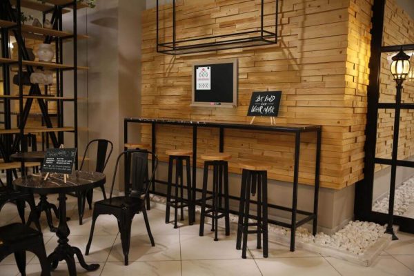 Desktop mini Easel holding a chalk board on the tables in a restaurant