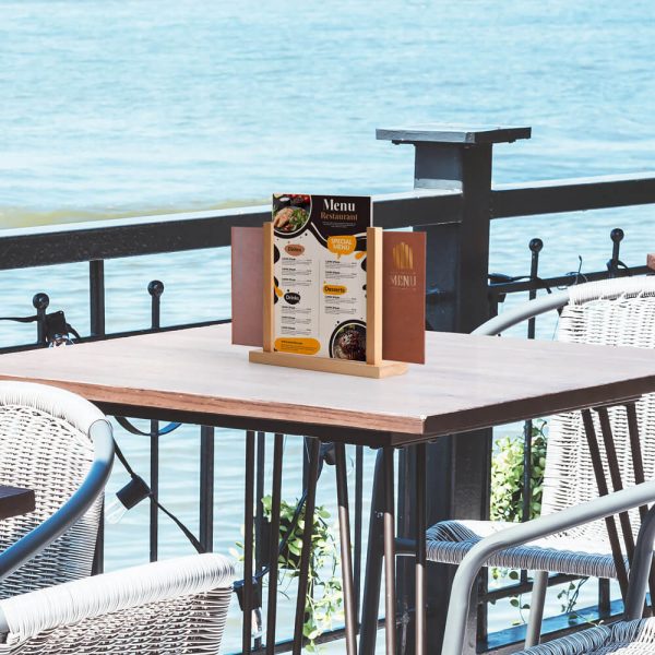 Desk top menu holder on a table next to the ocean