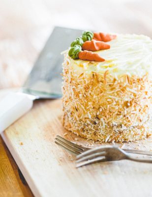 carrot cake with forks nearby