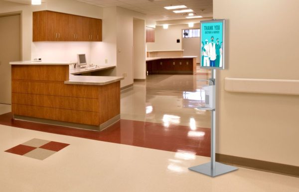 Floor Standing Hand Sanitizer Dispenser with Opti Frame in the hallway of a hospital