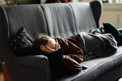 woman lying on couch