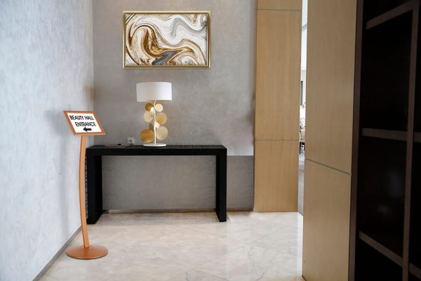 Copper Pedestal Sign Holder displaying where the Beauty Hall is in an event center