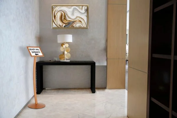 Copper Pedestal Sign Holder displaying where the Beauty Hall is in an event center