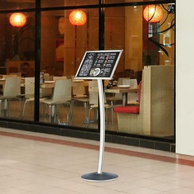 Curved menu board holding a menu outside of a restaurant
