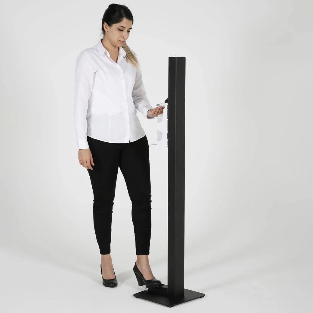 basic-touchless-hand-sanitizer-dispenser-1000-ml-33-8-oz-black-manual-foot-operated (9) A woman getting hand sanitizer from the black touchless hand sanitizer dispenser with foot pedal
