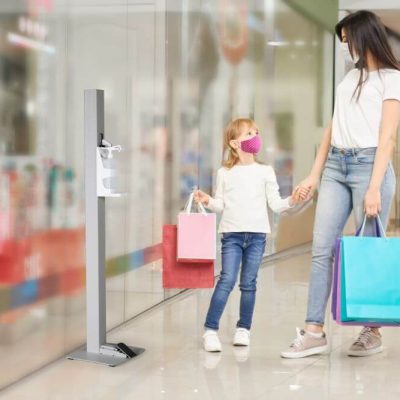 Gray Touchless Hand Sanitizer Dispenser in a mall with a mother and her daughter walking next to it