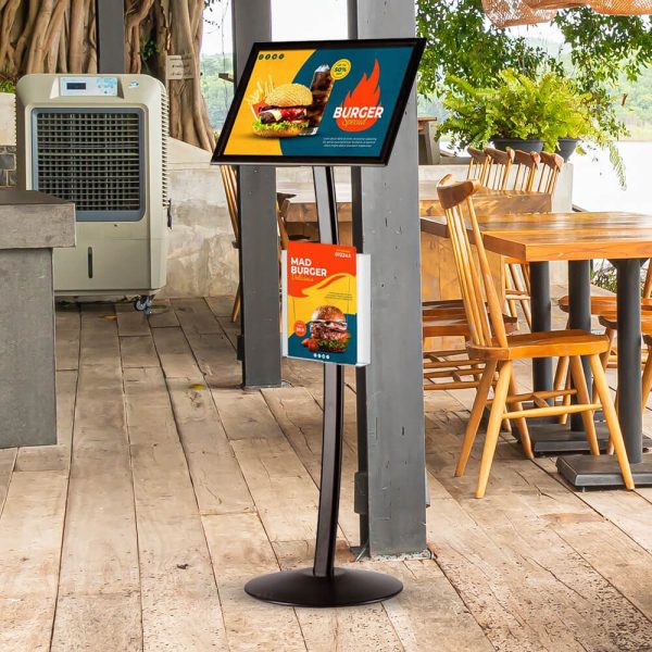 A menu board in an outside seating section of a restaurant