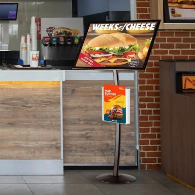 A large menu board on the customer side of the counter at a restaurant