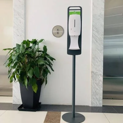 Floor Standing Automatic Touch Free Sensor Liquid Hand Sanitizer Dispenser with Dip Tray in front of elevators