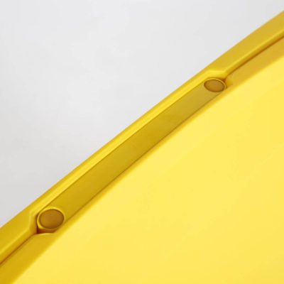 The top of the yellow sandwich board a-frame sidewalk sign handle