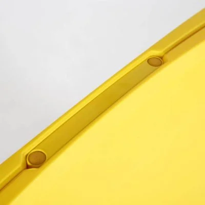 The top of the yellow sandwich board a-frame sidewalk sign handle