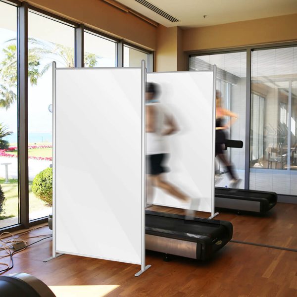 Wall Separator between treadmills in a gym with people working out on them