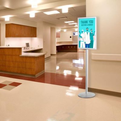 Pedestal Sign Holder Stand, Double Sided, in a hospital