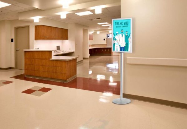 Pedestal Sign Holder Stand, Double Sided, in a hospital
