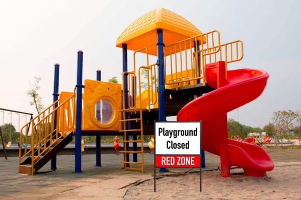 H Frame Yard Sign in front of a playground that says "Playground Closed"